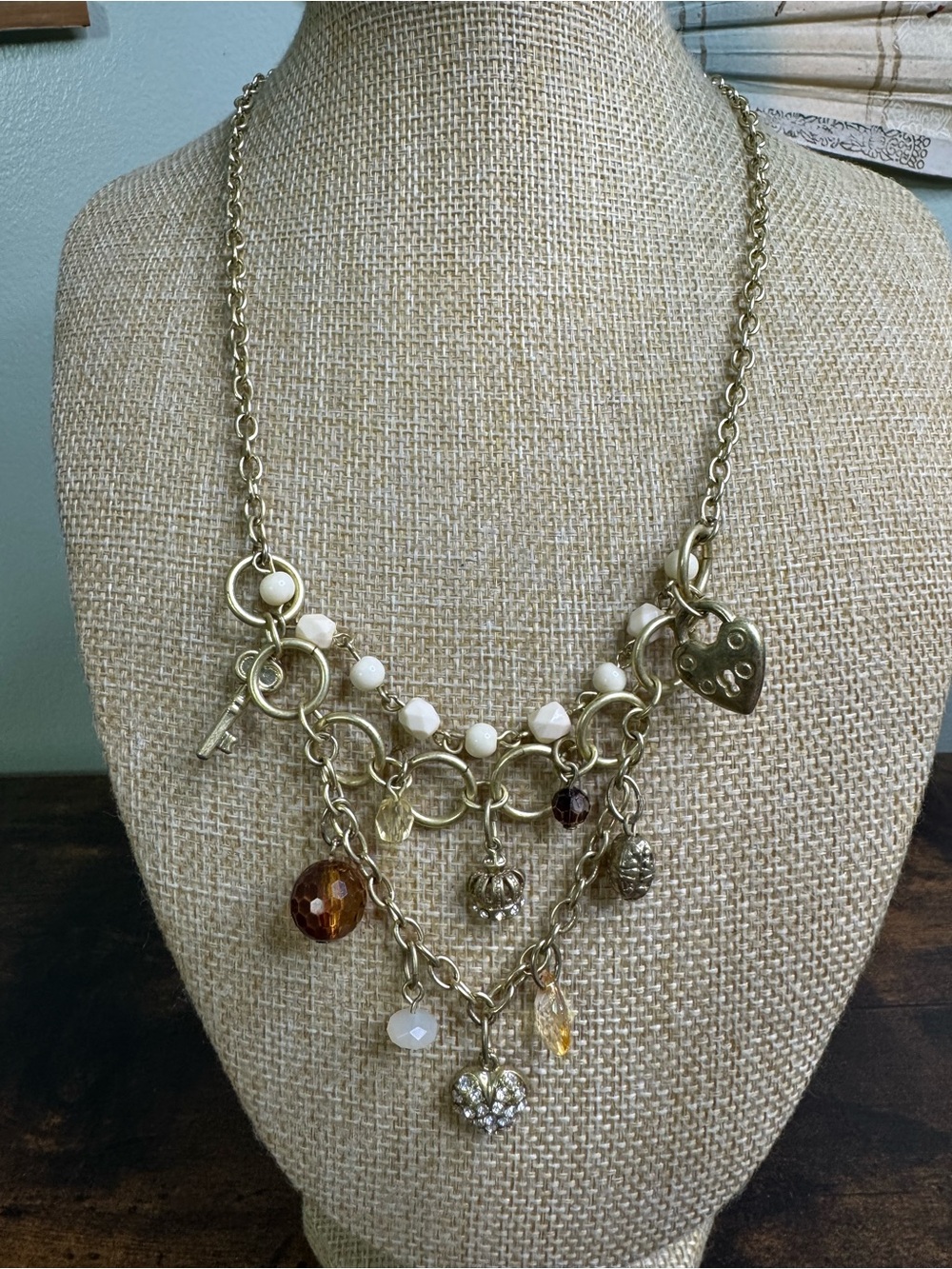 Avon Gold-Tone Heart/Key/Crown Charm Necklace with Cream and Amber Beads